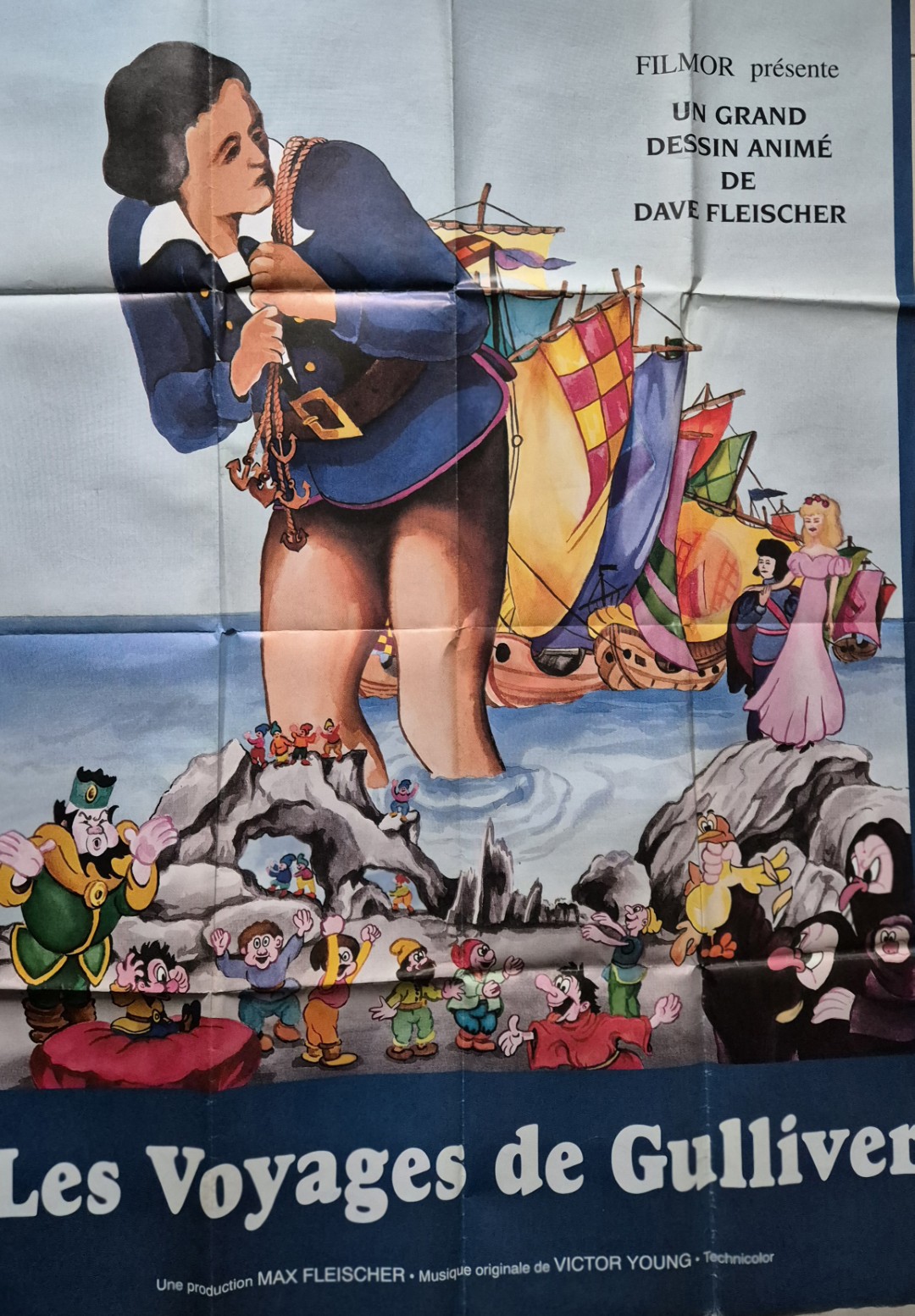Affiche du film Les Voyages de Gulliver montrant Gulliver parmi les Lilliputiens.