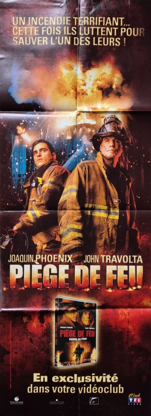 Affiche officielle du film Piège de feu (2004) réalisé par Jay Russell avec John Travolta et Joaquin Phoenix.